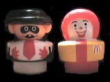 Redesigned larger (2'' tall and 1 3/4'' wide), Hamburglar and Ronald McDonald chunky little people.  Copyright 1991.